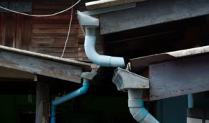 vecteezy_galvanized-rain-gutter-drainage-with-pvc-pipes-in-front-of_26549980