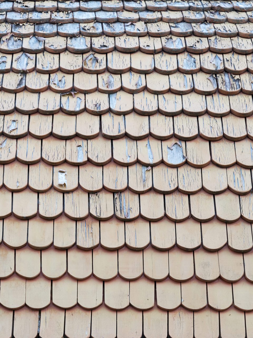 Old, wooden shabby roof of a country house. Wood texture.